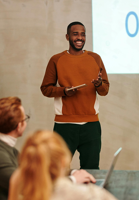 Junior software developer presenting technical concepts to a team
