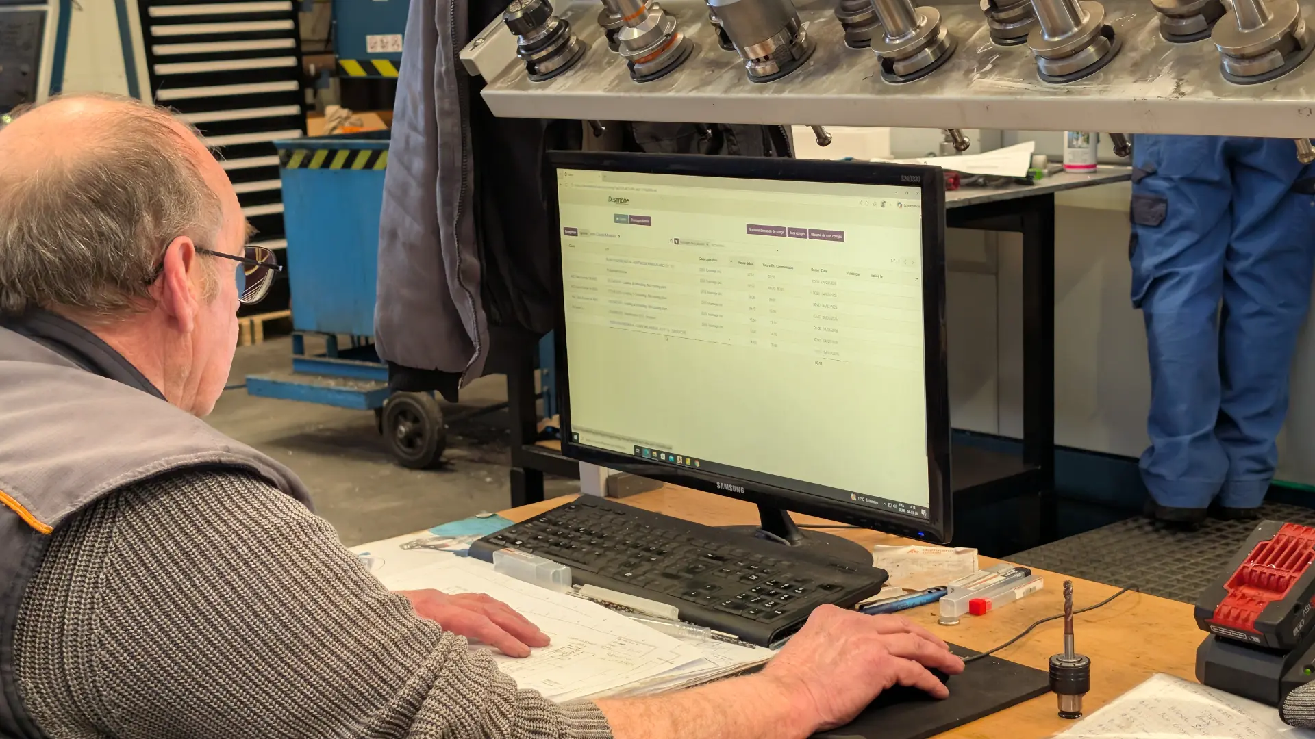 A person works on a computer displaying Odoo to manage professional tasks